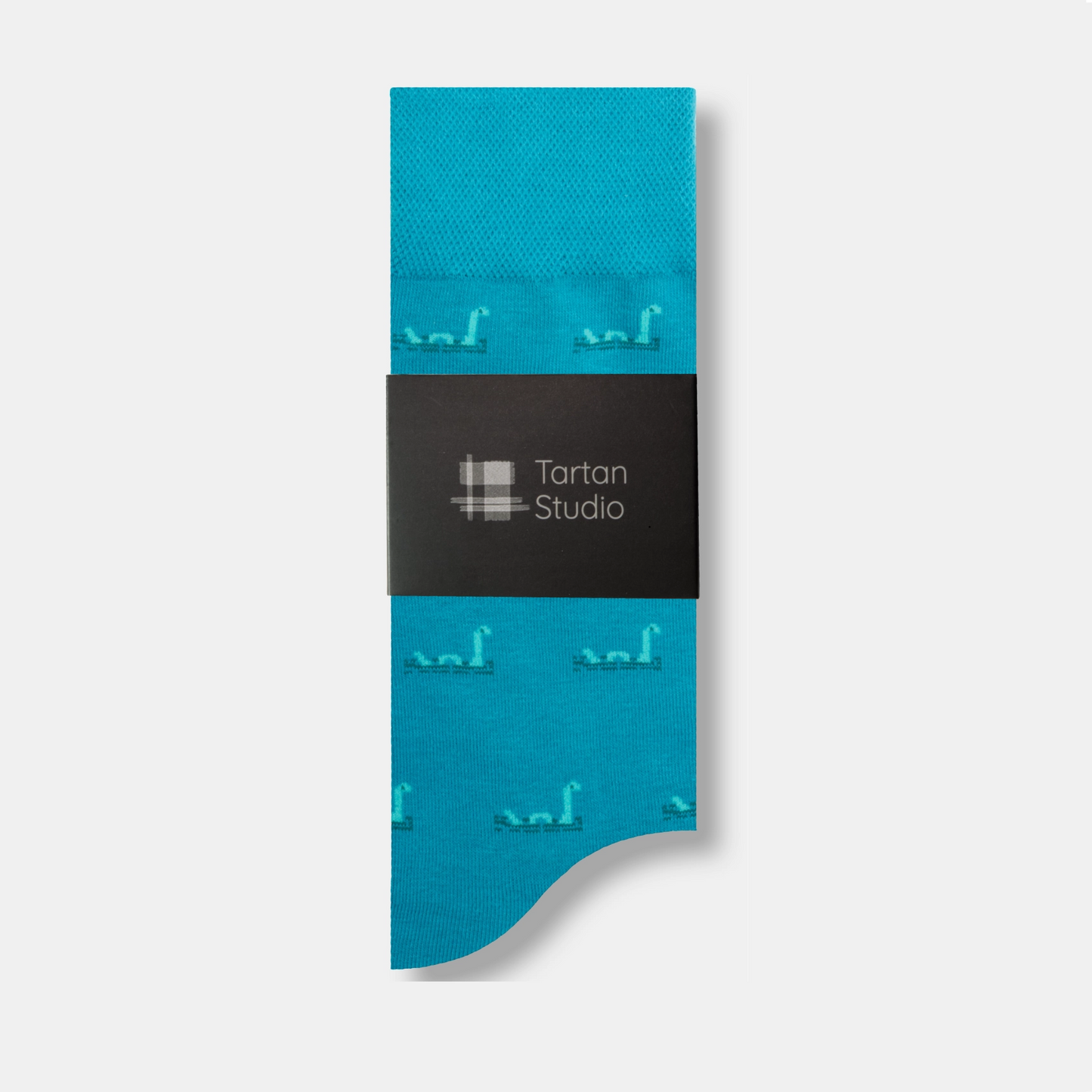 Loch ness monster socks with tartan studio label